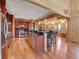 Spacious kitchen with stainless steel appliances and black countertops in a rustic log home at 29590 Buchanan Dr, Evergreen, CO 80439