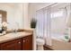 Bathroom featuring a tub, shower with white tile and a modern sink at 11089 Woodhurst Cir, Highlands Ranch, CO 80130