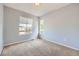 Empty bedroom with carpet, two windows and light grey walls at 11089 Woodhurst Cir, Highlands Ranch, CO 80130
