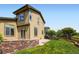 Exterior of a home featuring siding, windows, well-maintained lawn, and concrete patio at 11089 Woodhurst Cir, Highlands Ranch, CO 80130