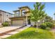 Inviting two-story home with landscaped lawn, stone accents, and a convenient two-car garage at 11089 Woodhurst Cir, Highlands Ranch, CO 80130
