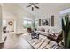 Bright living room featuring high ceilings, with stylish decor and natural light at 11089 Woodhurst Cir, Highlands Ranch, CO 80130