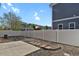 Fenced backyard with low maintenance landscaping, mature trees, and space for outdoor activities at 20826 Robins Dr, Denver, CO 80249