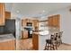 Well-equipped kitchen with stainless steel appliances and breakfast bar seating at 20826 Robins Dr, Denver, CO 80249