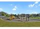 Community playground offering recreational activities with a variety of play structures and open space at 20826 Robins Dr, Denver, CO 80249