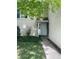Inviting front entrance with well-maintained lawn and fresh landscape at 482 S Kalispell Way # E, Aurora, CO 80017