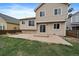 Back of home with large windows, sliding glass door, and concrete patio at 16175 Peregrine Dr, Parker, CO 80134