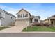 Charming two-story home with a well-maintained lawn, two car garage, and inviting curb appeal at 16175 Peregrine Dr, Parker, CO 80134