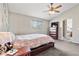 Comfortable bedroom with a vaulted ceiling, a ceiling fan, and an attached bathroom at 3137 E 112Th Pl, Thornton, CO 80233