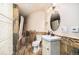 Bathroom with stylish white vanity, custom tile work, and bathtub shower at 12555 Critchell Ln, Littleton, CO 80127