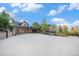 A luxurious home with a circular driveway and basketball hoop in a stunning residential neighborhood at 12555 Critchell Ln, Littleton, CO 80127