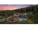 Stunning home with a pool, hot tub, and forest views, offering luxury and serenity at 12555 Critchell Ln, Littleton, CO 80127