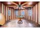 Bright game room featuring custom wood finishes, a pool table, and large windows at 12555 Critchell Ln, Littleton, CO 80127