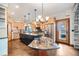 Spacious kitchen featuring a large island, stainless steel appliances, and an open layout with a view to the outside at 12555 Critchell Ln, Littleton, CO 80127