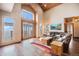 Bright living room with vaulted ceilings, a large sliding glass door, and hardwood floors at 12555 Critchell Ln, Littleton, CO 80127