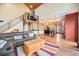 Open-concept living space showcasing vaulted ceilings, hardwood floors, a kitchen, and loft area at 12555 Critchell Ln, Littleton, CO 80127