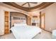 Spacious main bedroom boasts unique tray ceiling and ensuite bathroom access at 12555 Critchell Ln, Littleton, CO 80127