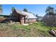 Outdoor outbuilding with a partial glass roof on a green lot with steps, offering a unique space at 12555 Critchell Ln, Littleton, CO 80127