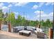 Outdoor patio with comfortable seating and a stunning view of the forest and mountains at 12555 Critchell Ln, Littleton, CO 80127