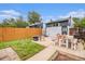 Backyard featuring a patio with furniture, a wooden fence, small lawn, and garden at 3764 N Raleigh St, Denver, CO 80212