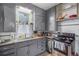 Well-lit kitchen with stainless steel appliances and functional design at 3764 N Raleigh St, Denver, CO 80212