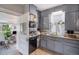 Efficient kitchen layout with gray cabinets and modern appliances at 3764 N Raleigh St, Denver, CO 80212