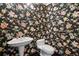 The powder room is adorned with a floral wallpaper, pedestal sink and toilet with black flooring at 2400 E Cherry Creek South Dr # 207, Denver, CO 80209