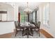 Traditional dining room with wood floors, and a vintage chandelier hanging over the wood table at 2400 E Cherry Creek South Dr # 207, Denver, CO 80209