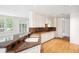 Updated kitchen with white cabinets, granite countertops, stainless appliances, and an adjacent breakfast area at 2400 E Cherry Creek South Dr # 207, Denver, CO 80209
