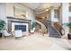 Grand lobby features a fireplace, staircase, high ceilings, and elegant finishes with marble floors at 2400 E Cherry Creek South Dr # 207, Denver, CO 80209