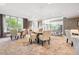 Condo lounge area is spacious, with seating areas, neutral color schemes, and large windows for natural light at 2400 E Cherry Creek South Dr # 207, Denver, CO 80209