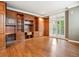 Office with wood floors, built-in wood shelving and cabinetry, as well as shutter blinds on the window at 2400 E Cherry Creek South Dr # 207, Denver, CO 80209