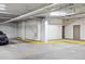 Well-lit parking garage with designated parking spots and easy access to the building at 2400 E Cherry Creek South Dr # 207, Denver, CO 80209