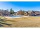 Expansive community pool area featuring a pool house and well-maintained landscaping at 18287 E Floyd Ave # L, Aurora, CO 80013