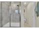 Bathroom featuring a glass-enclosed shower and a separate toilet room at 4884 St Vrain Rd, Firestone, CO 80504