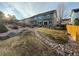 Landscaped backyard with patio, seating, hot tub, rock garden and lawn at 2447 Fairway Wood Cir, Castle Rock, CO 80109