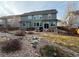 Relaxing backyard with a patio area, seating, hot tub, and landscaped rock features at 2447 Fairway Wood Cir, Castle Rock, CO 80109