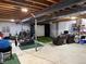 Unfinished basement featuring exercise equipment, home theater setup, and open ceiling at 2447 Fairway Wood Cir, Castle Rock, CO 80109