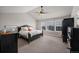 Bright bedroom with large windows, a ceiling fan, and ample space for furnishings at 2447 Fairway Wood Cir, Castle Rock, CO 80109