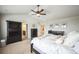 Spacious bedroom with a vaulted ceiling, ceiling fan, and ensuite bathroom access at 2447 Fairway Wood Cir, Castle Rock, CO 80109