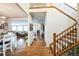 Welcoming entryway with staircase, views of living room, and a fireplace at 2447 Fairway Wood Cir, Castle Rock, CO 80109