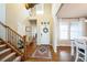 Grand entryway with high ceilings, staircase, and ample natural light from large windows at 2447 Fairway Wood Cir, Castle Rock, CO 80109
