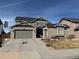 Charming two-story home with a well-maintained lawn, a two-car garage, and beautiful brick accents at 2447 Fairway Wood Cir, Castle Rock, CO 80109
