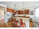 Modern kitchen with granite countertops, stainless steel appliances, and a center island at 2447 Fairway Wood Cir, Castle Rock, CO 80109