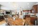 Open concept kitchen and dining area with hardwood floors and stainless steel appliances at 2447 Fairway Wood Cir, Castle Rock, CO 80109