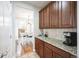 Kitchen featuring granite countertops, a breakfast bar, and a view into the dining room at 2447 Fairway Wood Cir, Castle Rock, CO 80109