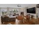 Cozy living room with a fireplace, large windows, and comfortable seating at 2447 Fairway Wood Cir, Castle Rock, CO 80109