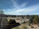 Scenic view of mountains and homes in the distance with trees and fence in foreground at 2447 Fairway Wood Cir, Castle Rock, CO 80109