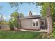 Private backyard with lush lawn, mature trees, and privacy create an oasis for relaxation at 1582 W Briarwood Ave, Littleton, CO 80120