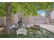 Private backyard deck is perfect for outdoor entertaining and relaxing under the trees at 1582 W Briarwood Ave, Littleton, CO 80120